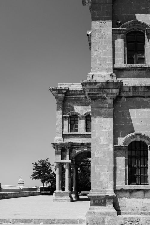 Free Monochrome image highlighting the intricate details of a historic stone building. Stock Photo
