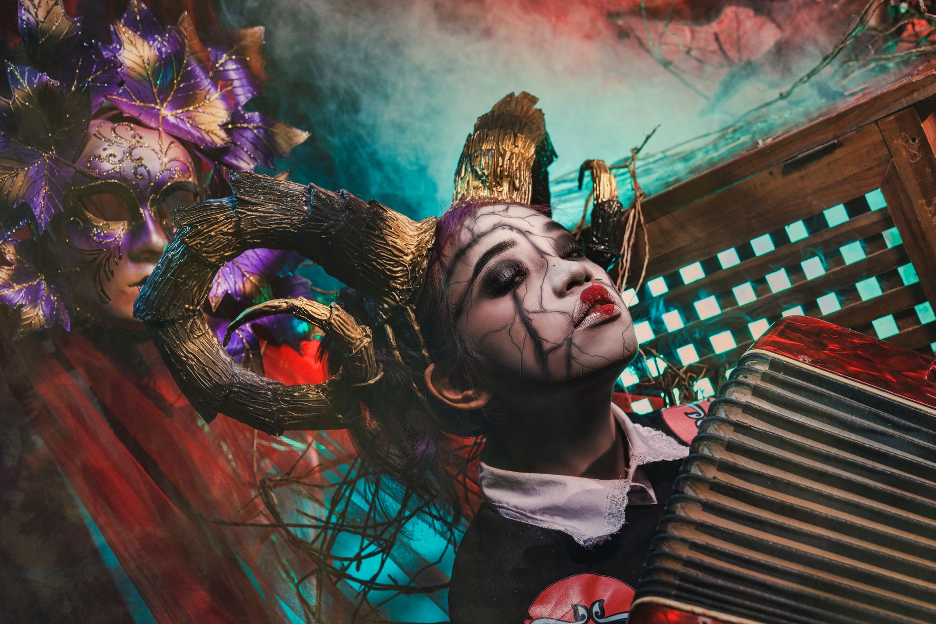 Surreal portrait of a makeup artist in elaborate costume with an accordion