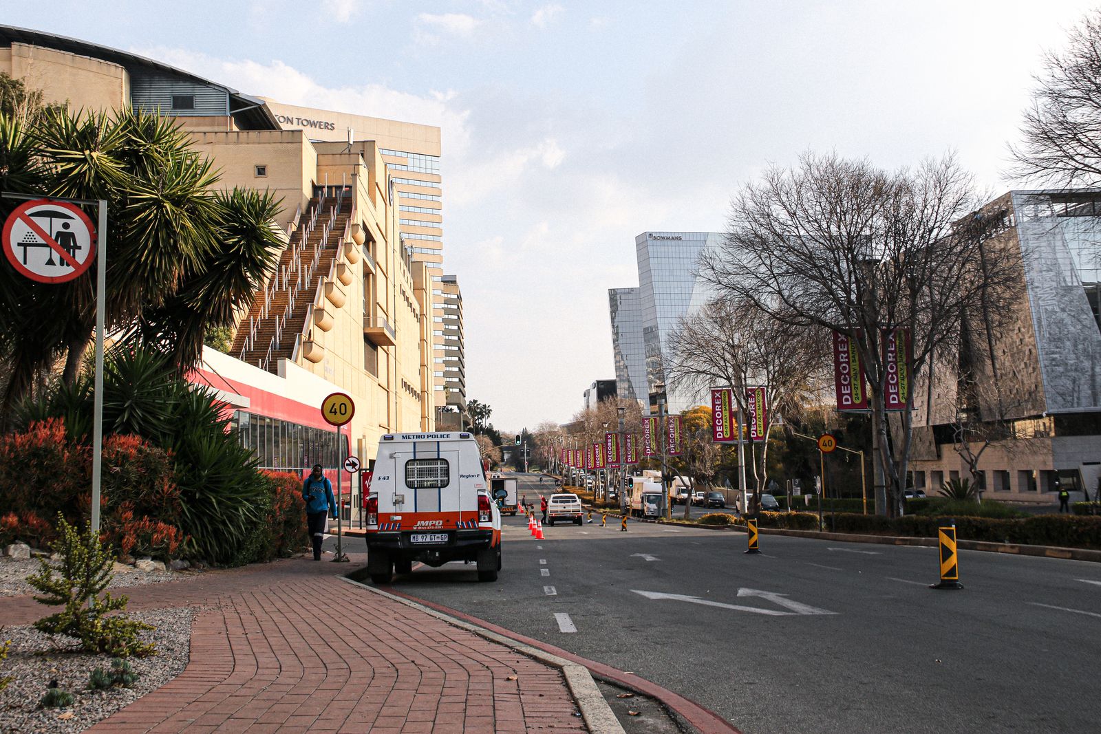 A vibrant street view of Johannesburg featuring modern architecture and city life.