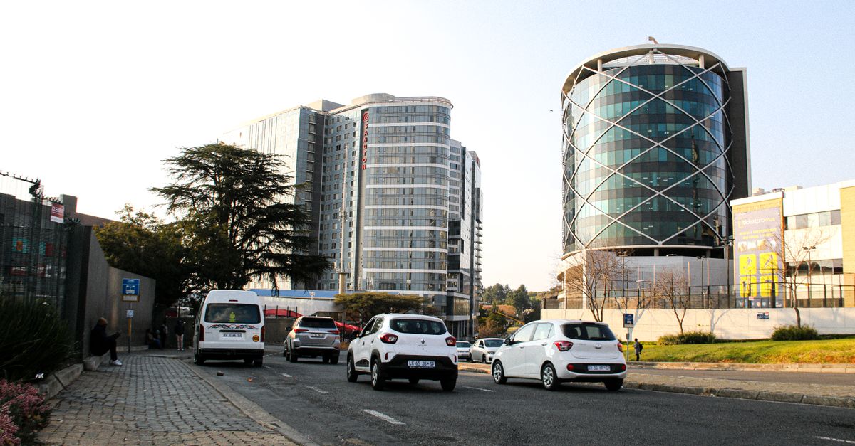 Urban scene of Johannesburg showing modern buildings and street traffic.