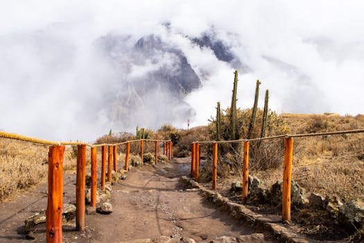 Dramatic view of a mountain trail leading into clouds in Cabanaconde, Arequipa, Peru.