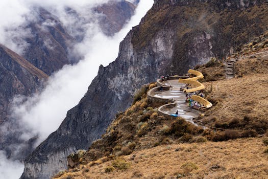 Visitors enjoying the breathtaking view at Colca Canyon in Cabanaconde, Peru.