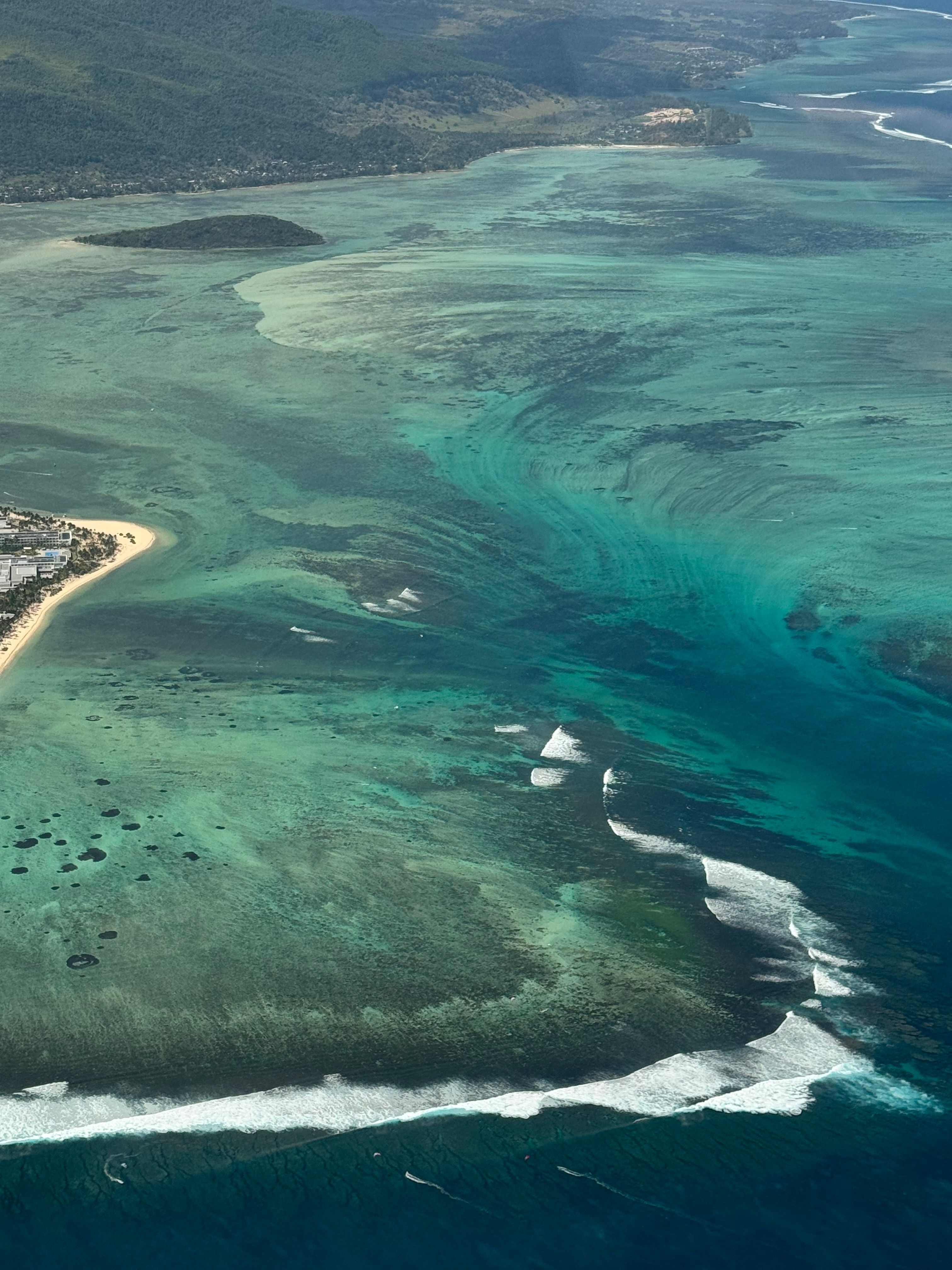An aerial view of the coast and turquoise water in Mauritius.