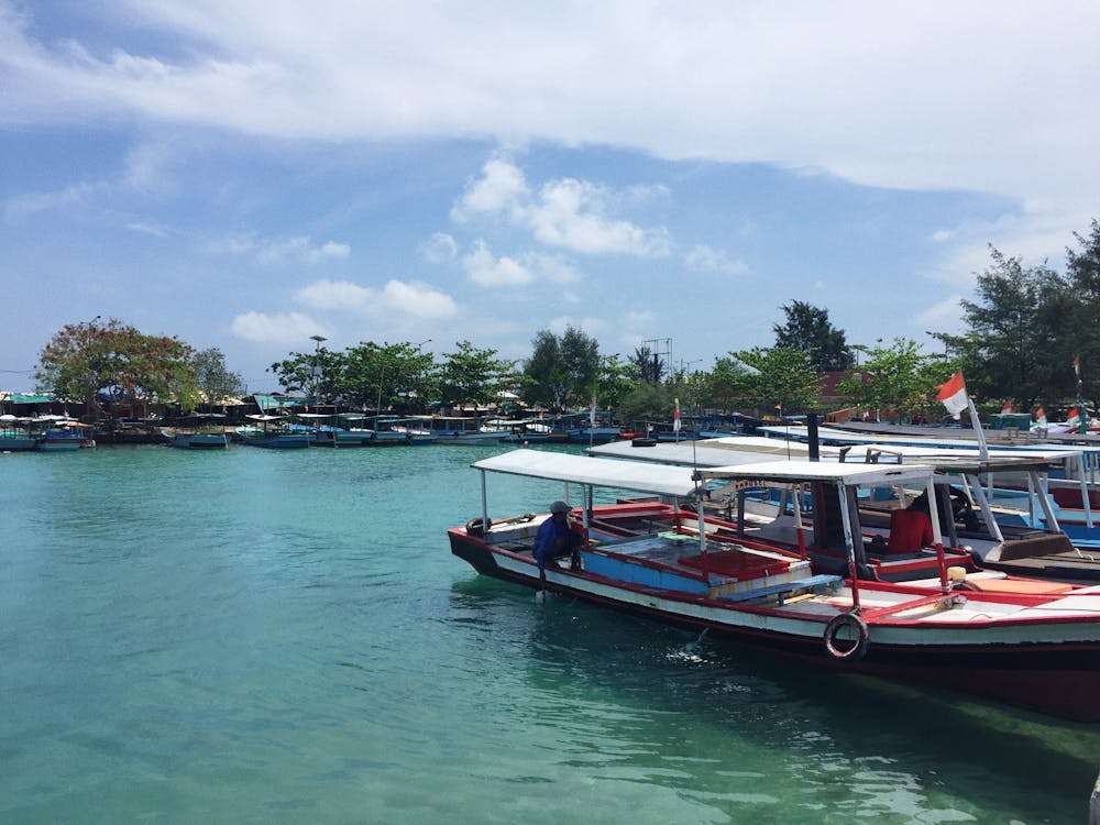 Free stock photo of beach island, boat, fisherman