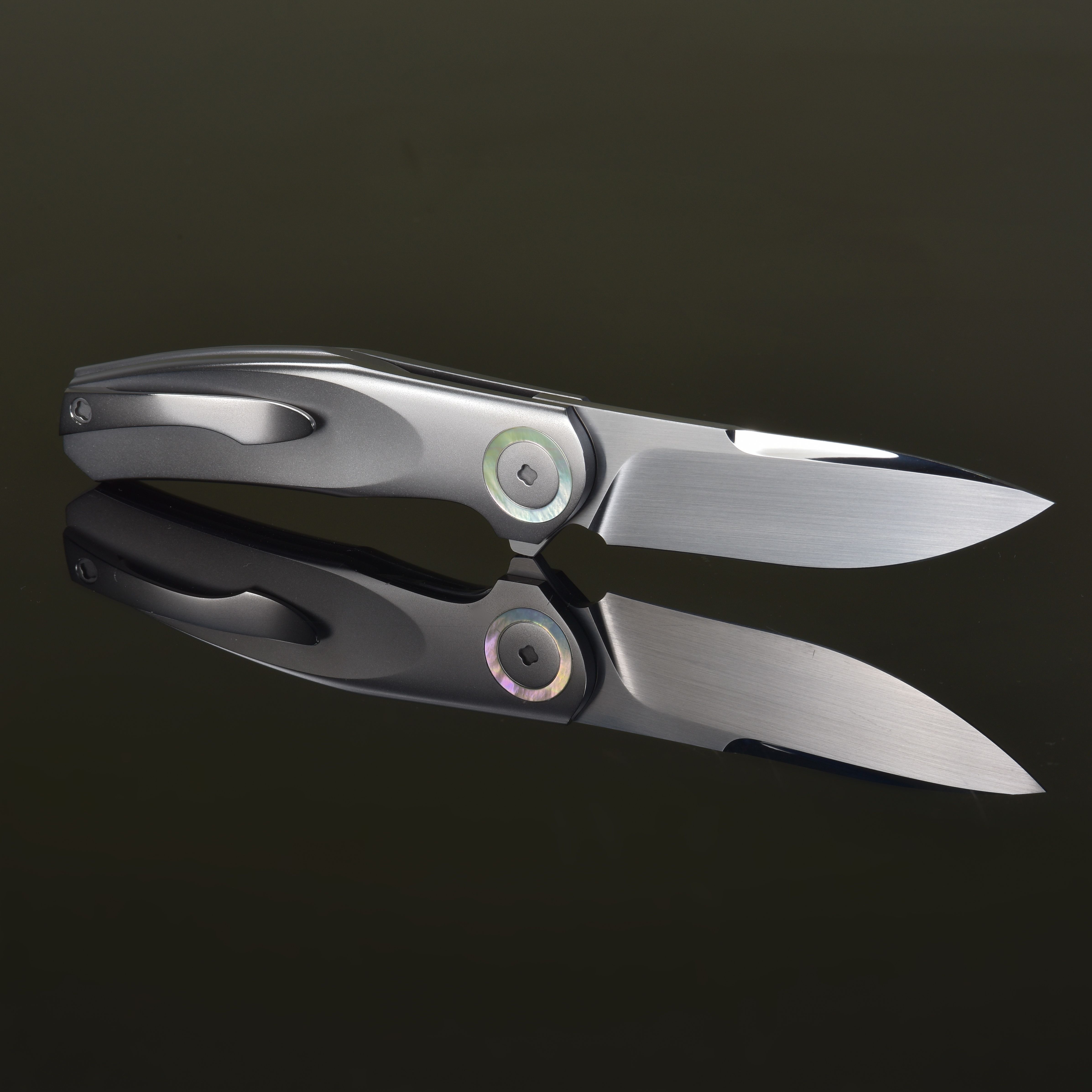 Sleek Stainless Steel Folding Knife Reflection · Free Stock Photo