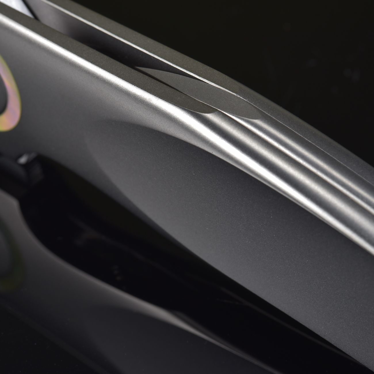 Detailed image of a sleek metallic knife blade with reflective surface.