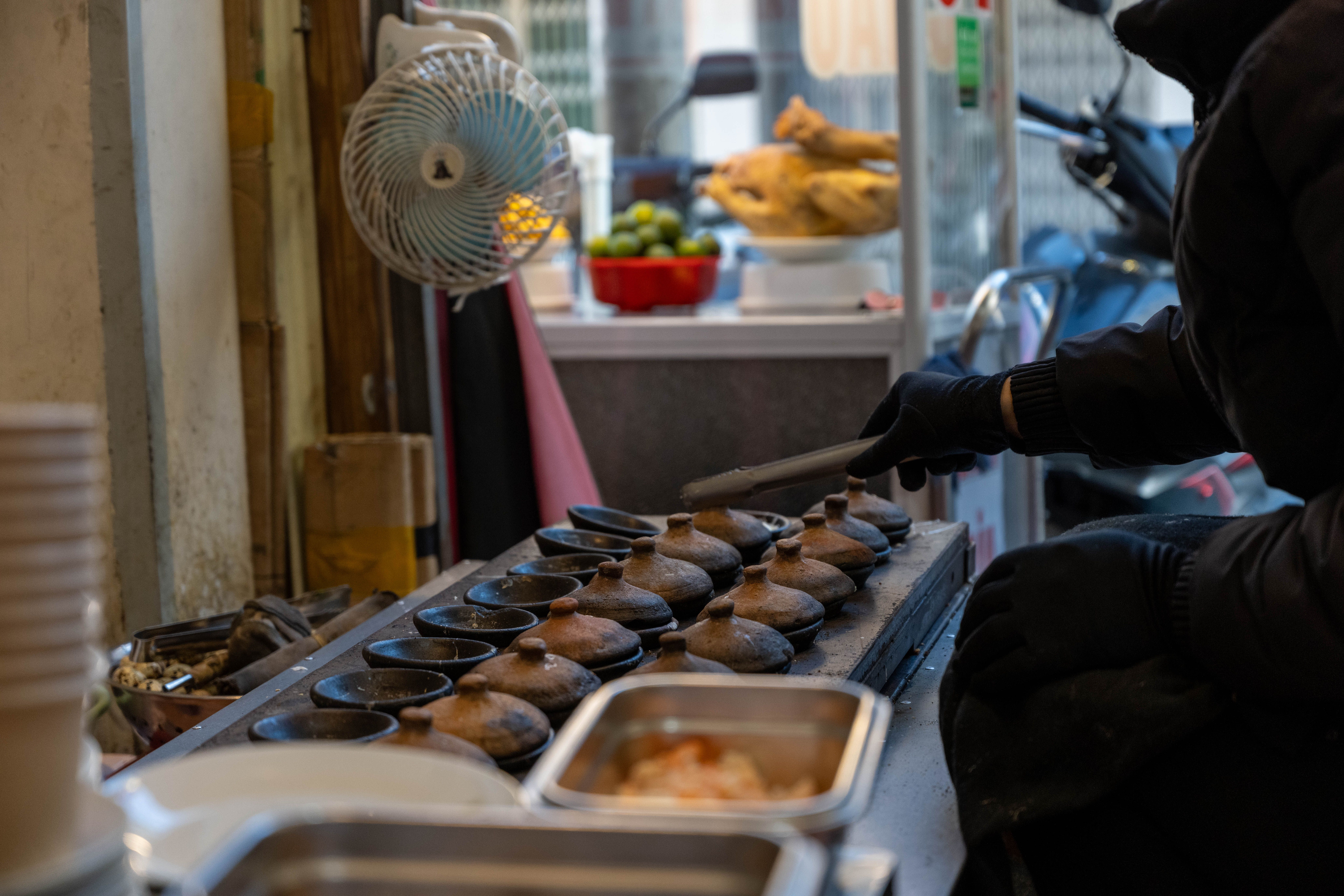 Local street food preparation at a popular stall in Xian