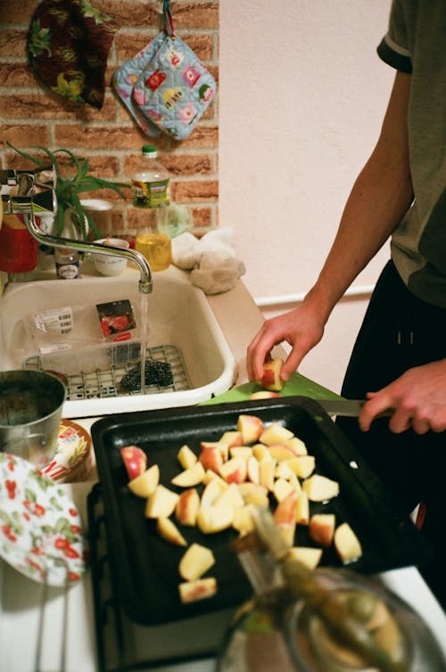 Man Slicing the Apple Fruit Photograph