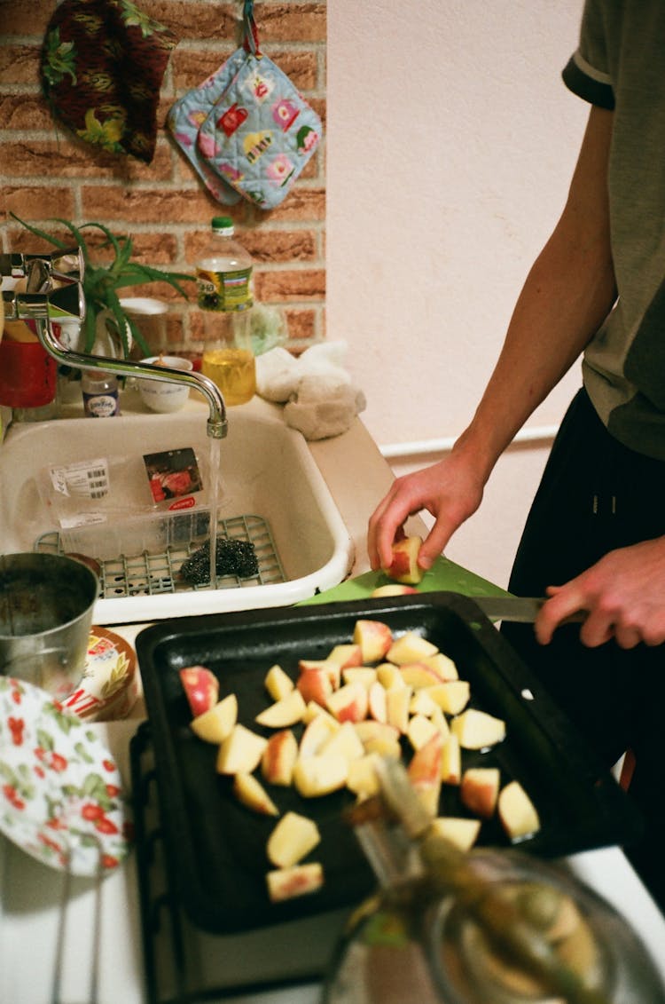 Man Slicing The Apple Fruit Photograph