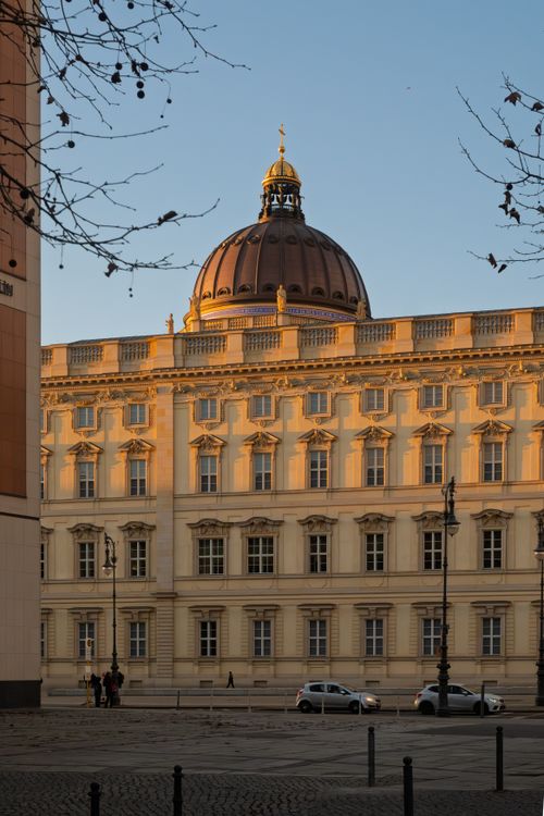 Free Beautiful view of the Berlin Palace bathed in warm autumn light, with a clear sky above. Stock Photo