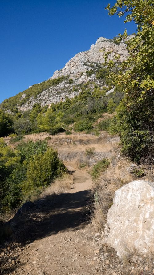 Free Scenic hiking trail on Vis Island, Croatia with clear blue skies. Stock Photo