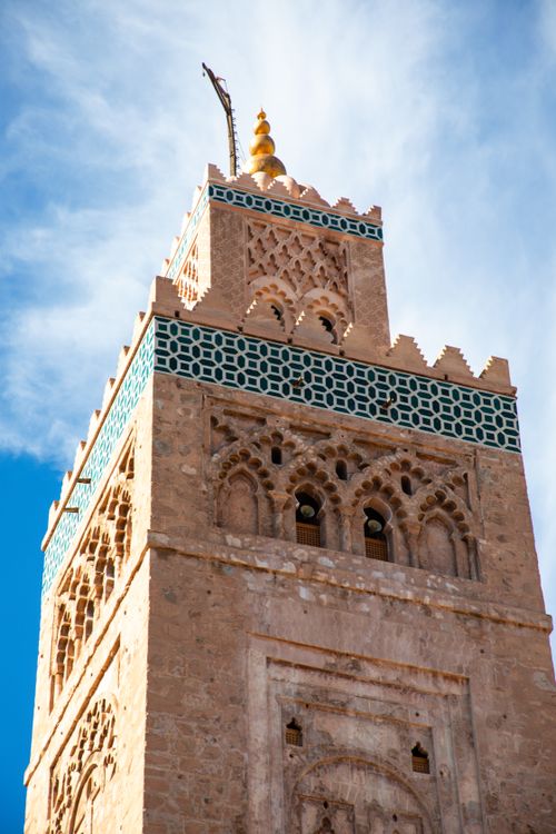 Free Koutoubia Mosque's ornate tower with intricate designs under a clear sky in Marrakesh, Morocco. Stock Photo
