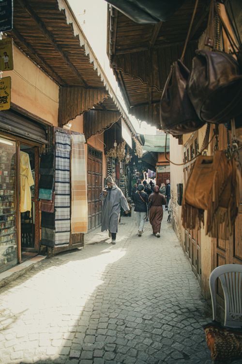 Free Explore the vibrant shopping streets of Marrakesh, showcasing traditional goods and lively atmosphere. Stock Photo