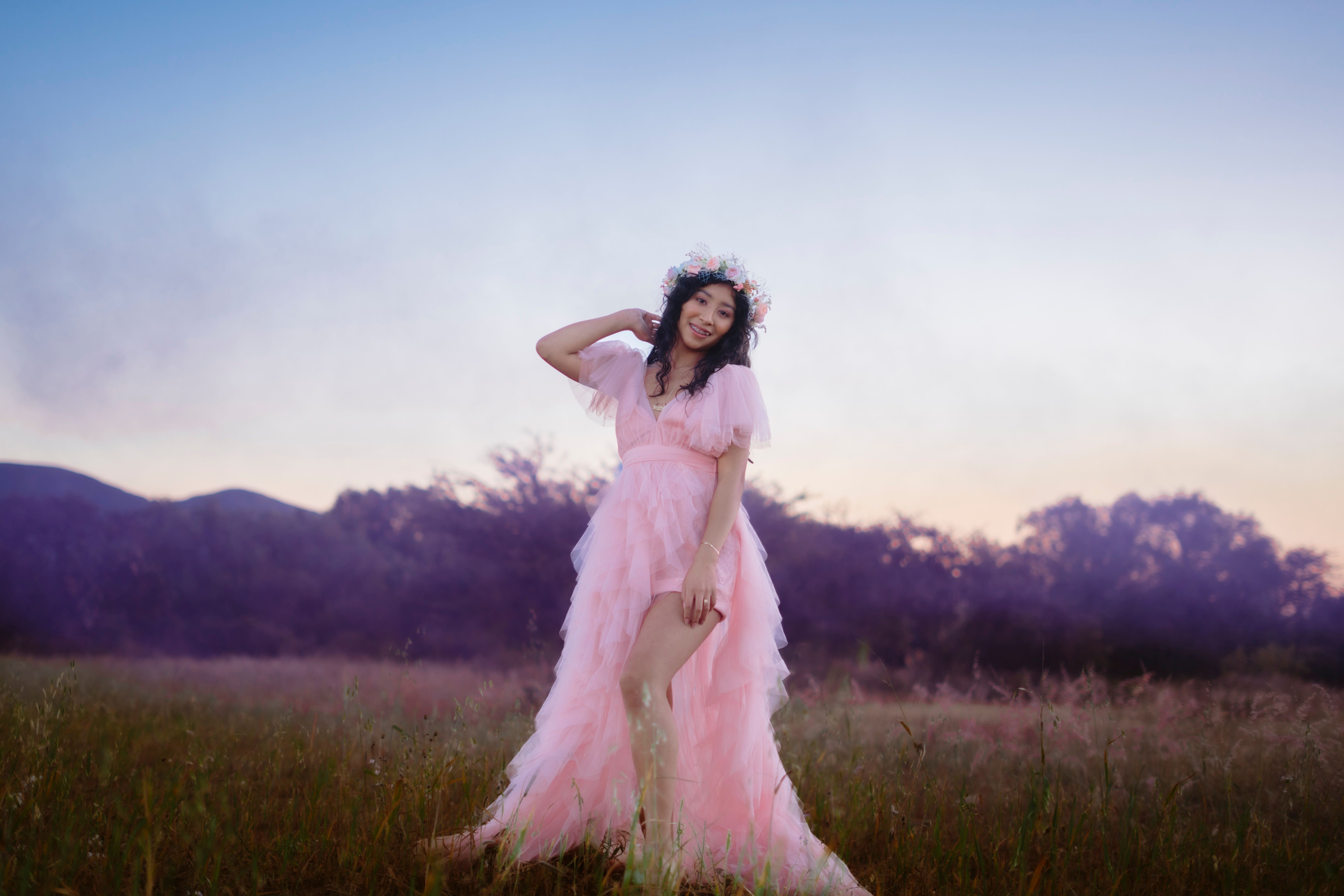 Woman in Pink Dress in Outdoor Field at Dusk · Free Stock Photo