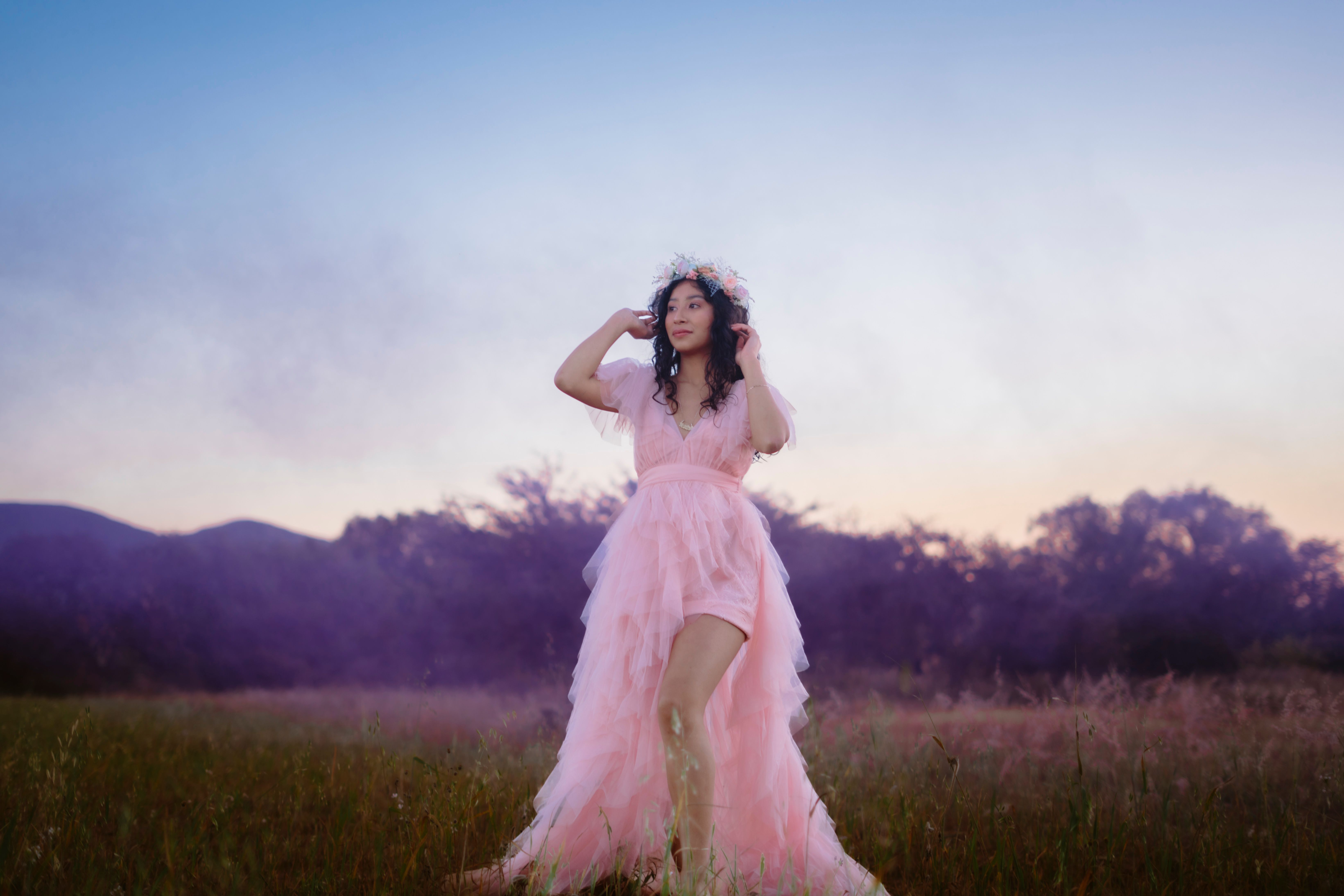 Woman in Pink Dress Standing in Pastel Field · Free Stock Photo
