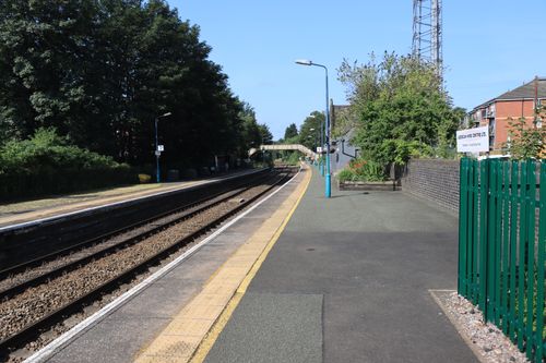 Free A serene morning at a suburban train station in Nantwich, England, with clear blue skies. Stock Photo
