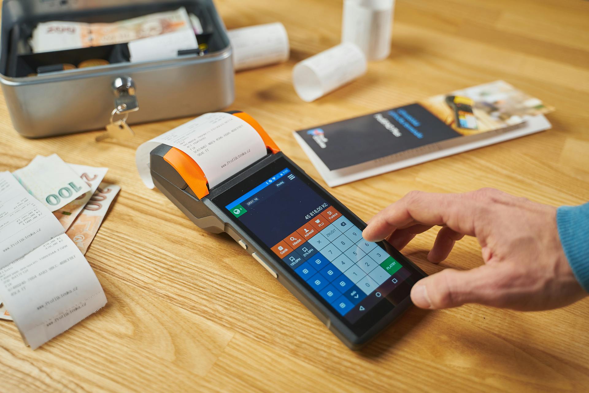 Terminal and Receipts on a Desk