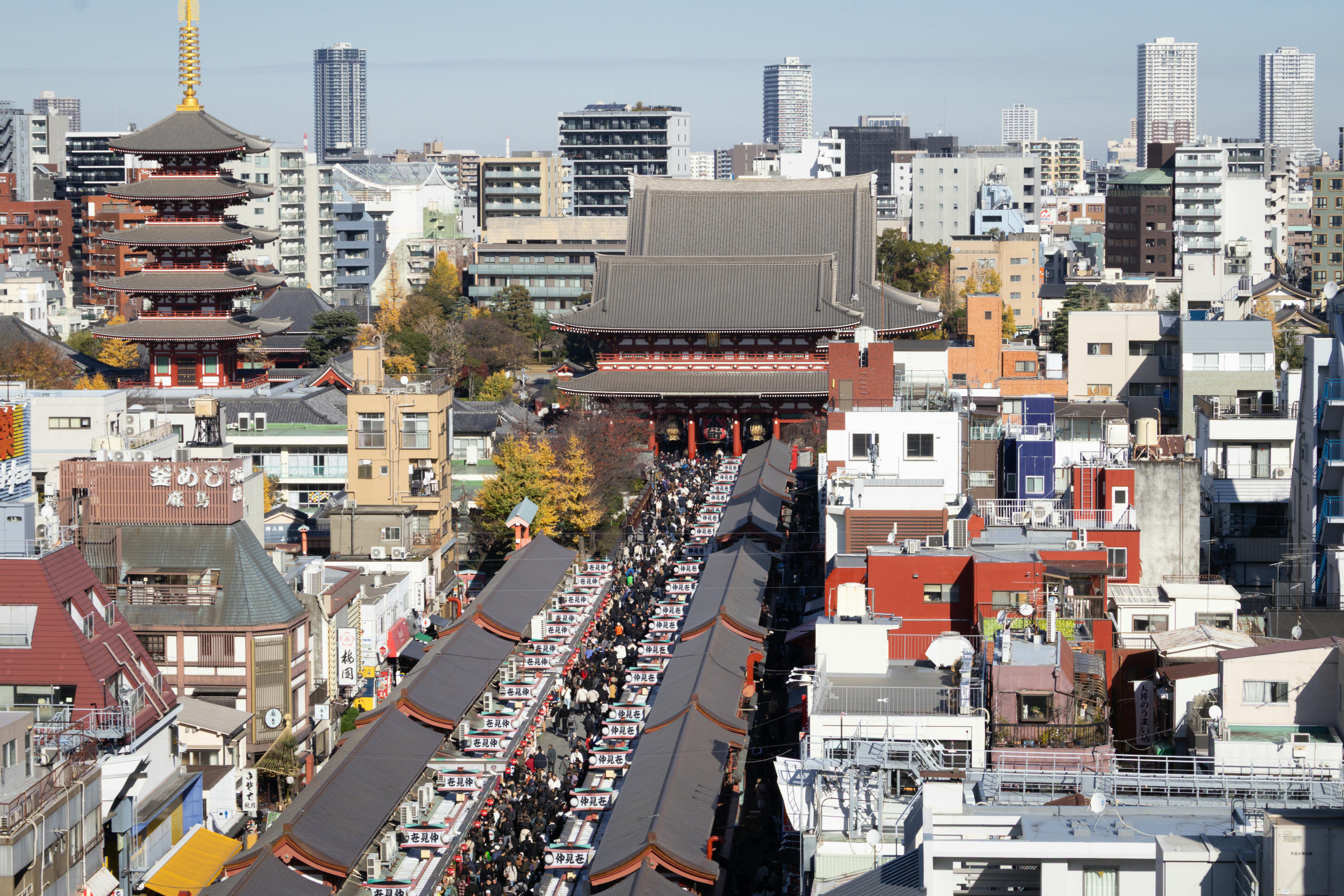 Traditional street view of Asakusa with low-rise buildings and modern elements