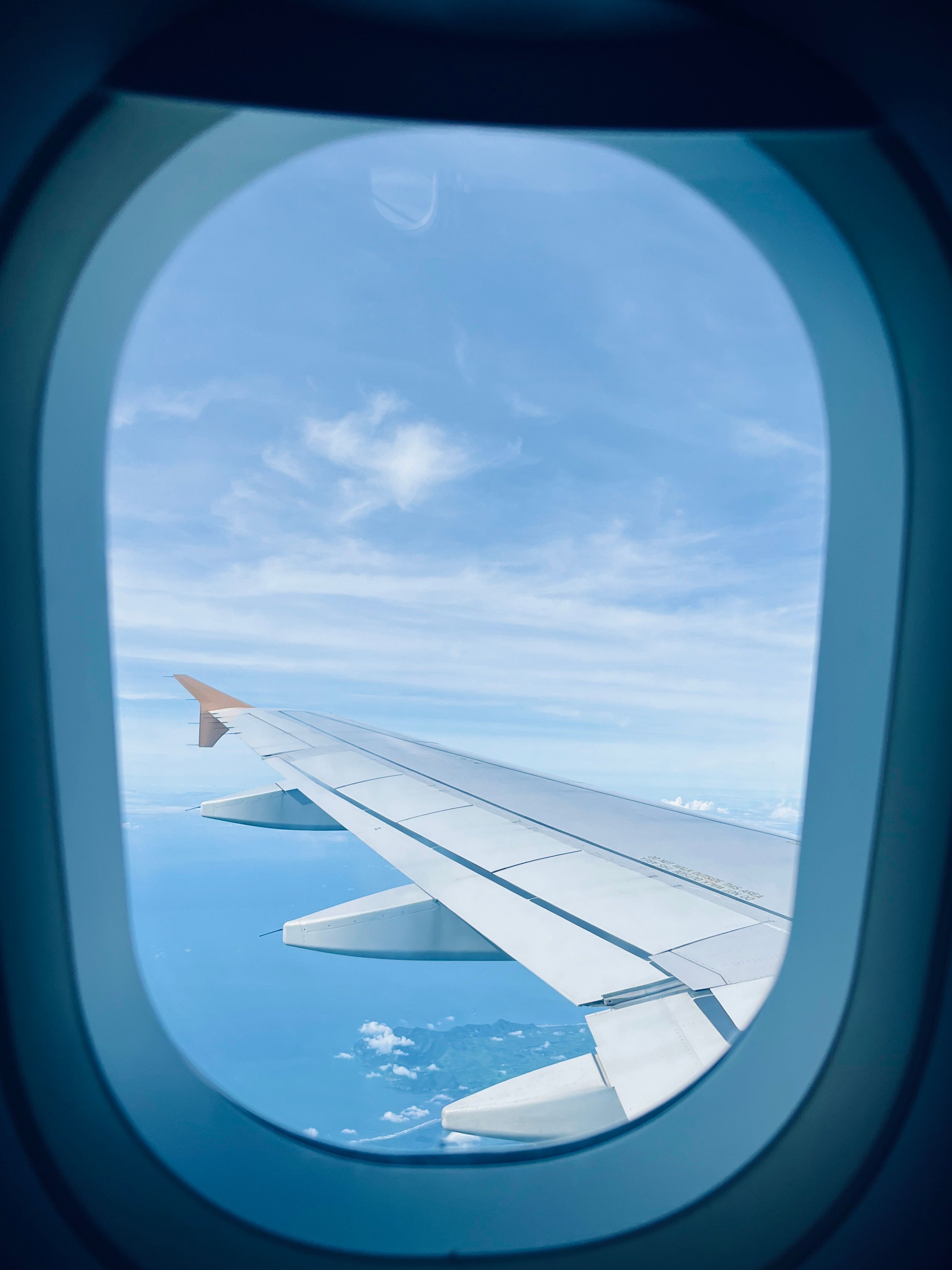 View of Airplane Wing from Window During Flight · Free Stock Photo