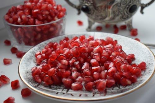 Red Round Fruits on White Glass Bowl