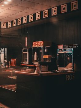 Retro movie theater concession stand with popcorn machines, evoking nostalgia.
