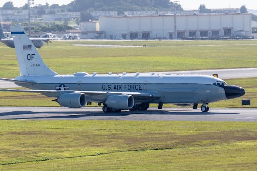 U.S. Air Force reconnaissance aircraft on an airfield runway, ready for takeoff.