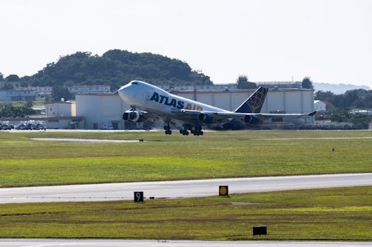 Atlas Air cargo plane takes off from an airport runway, showcasing aviation and logistics.