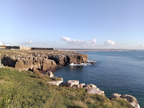 Beautiful coastal landscape of Peniche, Portugal with rocky cliffs and blue sea.