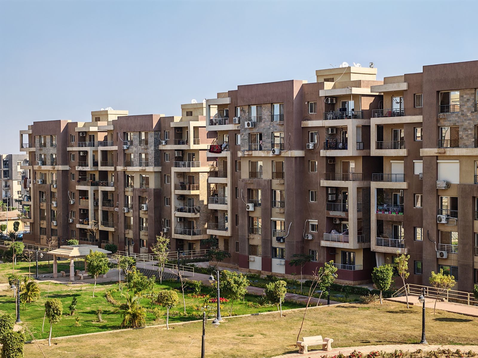 Modern Apartment Building in Urban Park · Free Stock Photo
