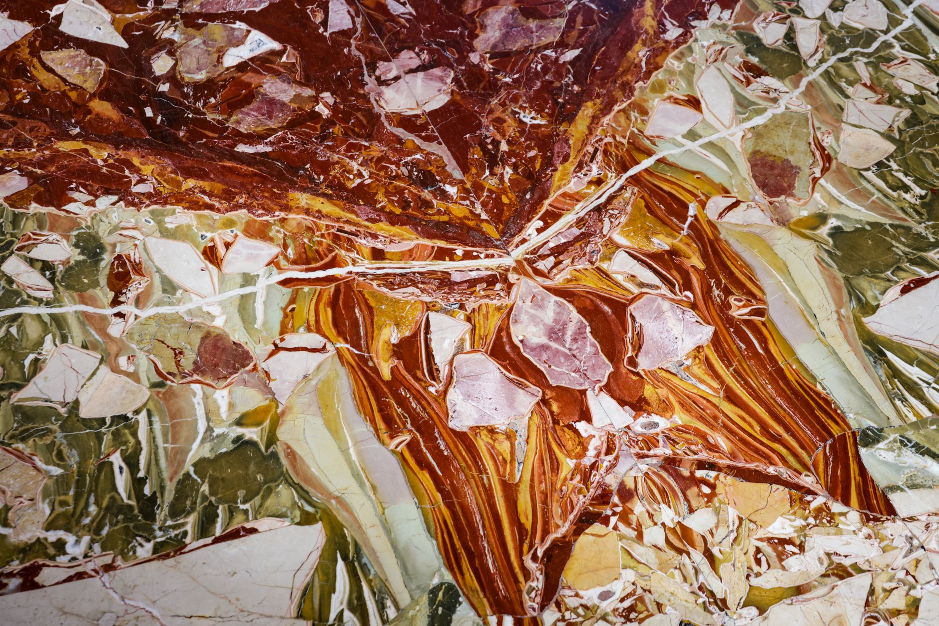 Close-up of a multicolored marble texture showcasing vibrant natural patterns and colors.