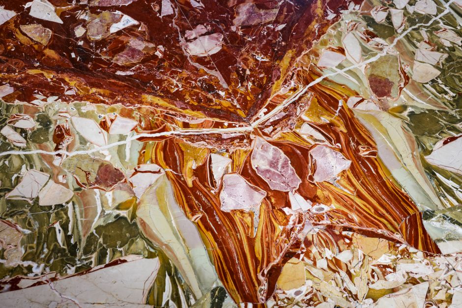 Natural stone slabs showing unique veining and colors Natural stone slabs showing unique veining and colors