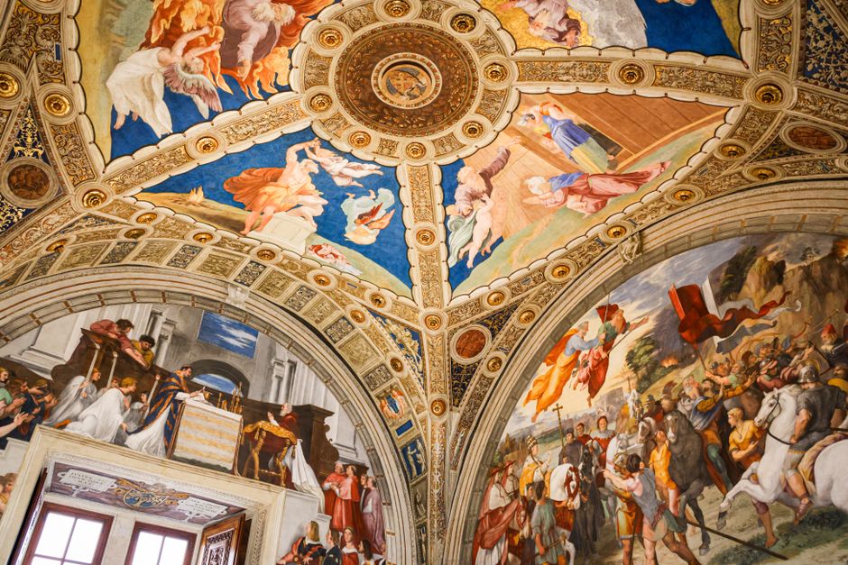 Intricate Renaissance frescoes adorn a grand ceiling, showcasing historical artistry.