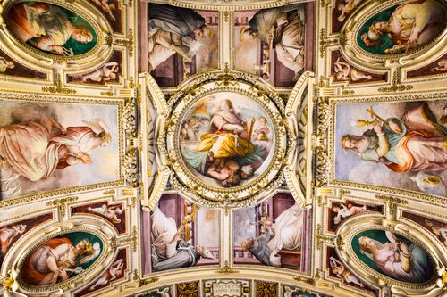 Free Explore the breathtaking detail of a Roman ceiling's painted art depicting historical and artistic themes. Stock Photo