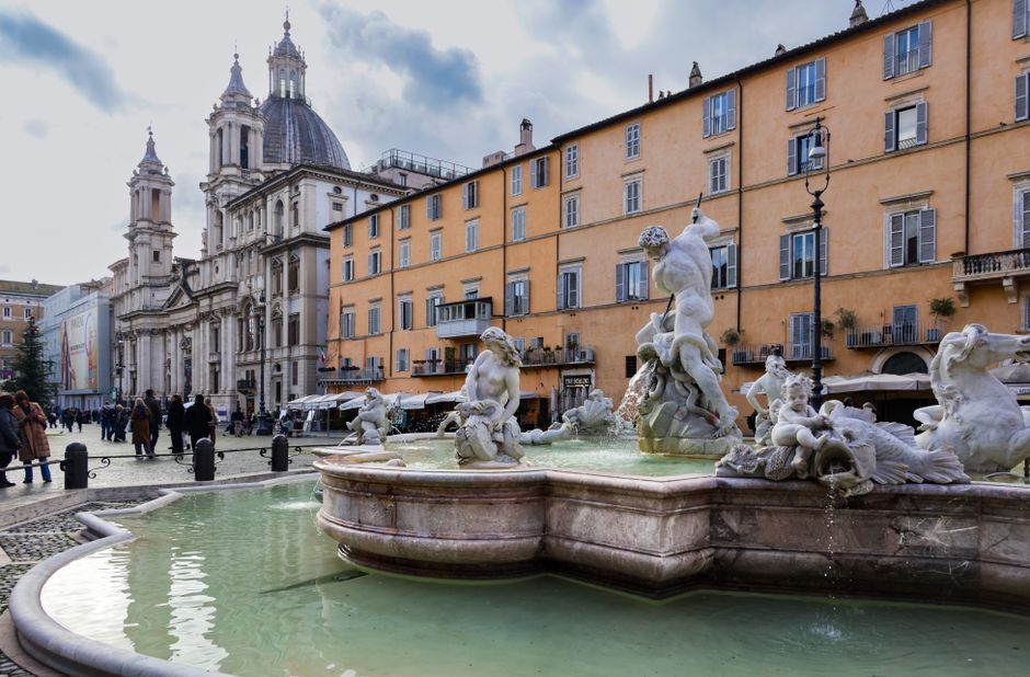 A beautiful capture of the Fountain of Neptune and Sant'Agnese in Agone church at Piazza Navona, Rome.