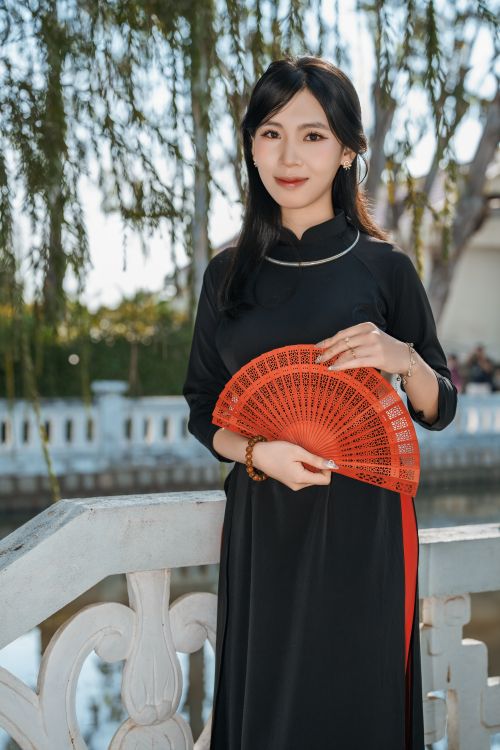 Elegant Woman in Traditional Dress with Red Fan · Free Stock Photo