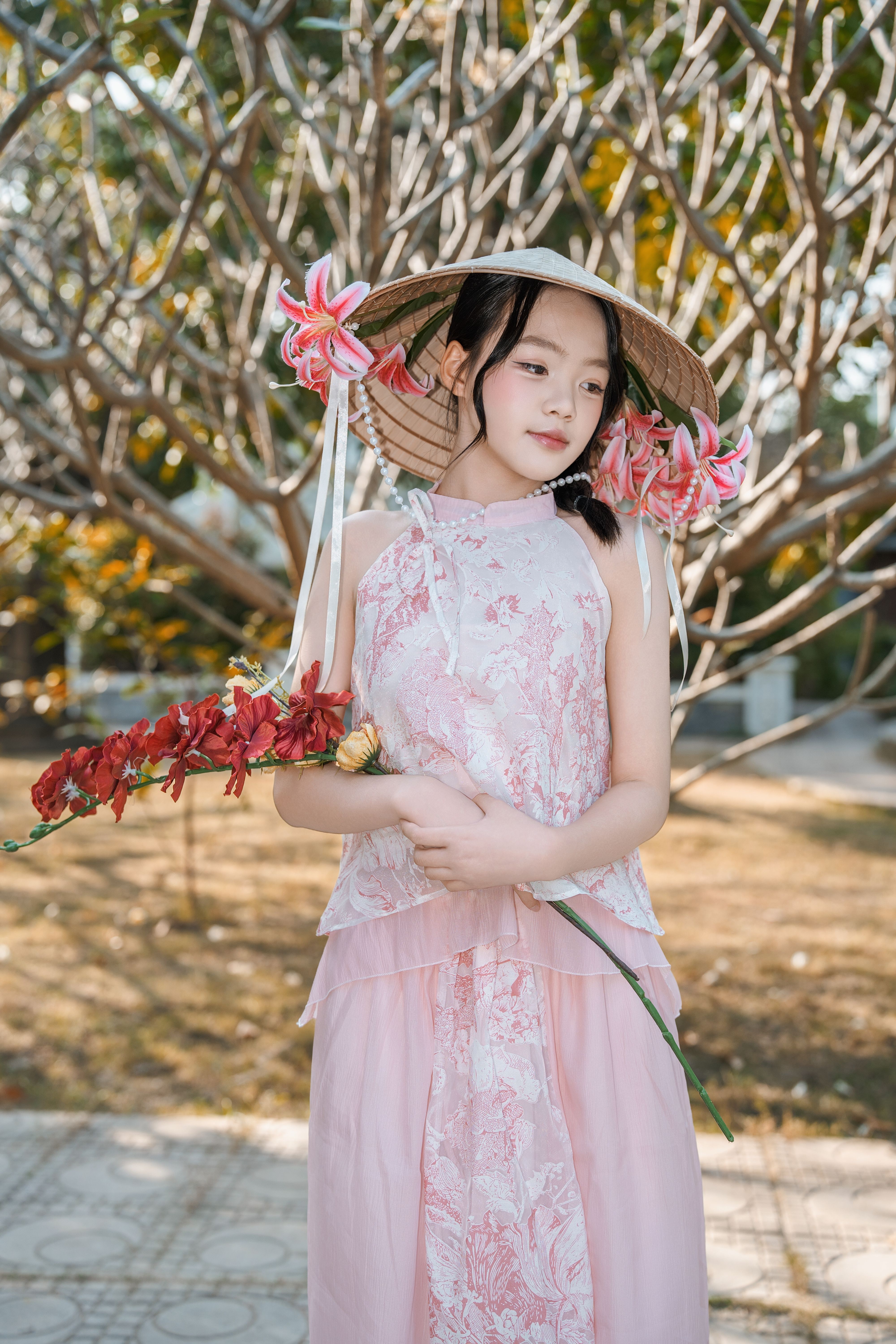 Young Girl in Traditional Dress with Floral Hat · Free Stock Photo