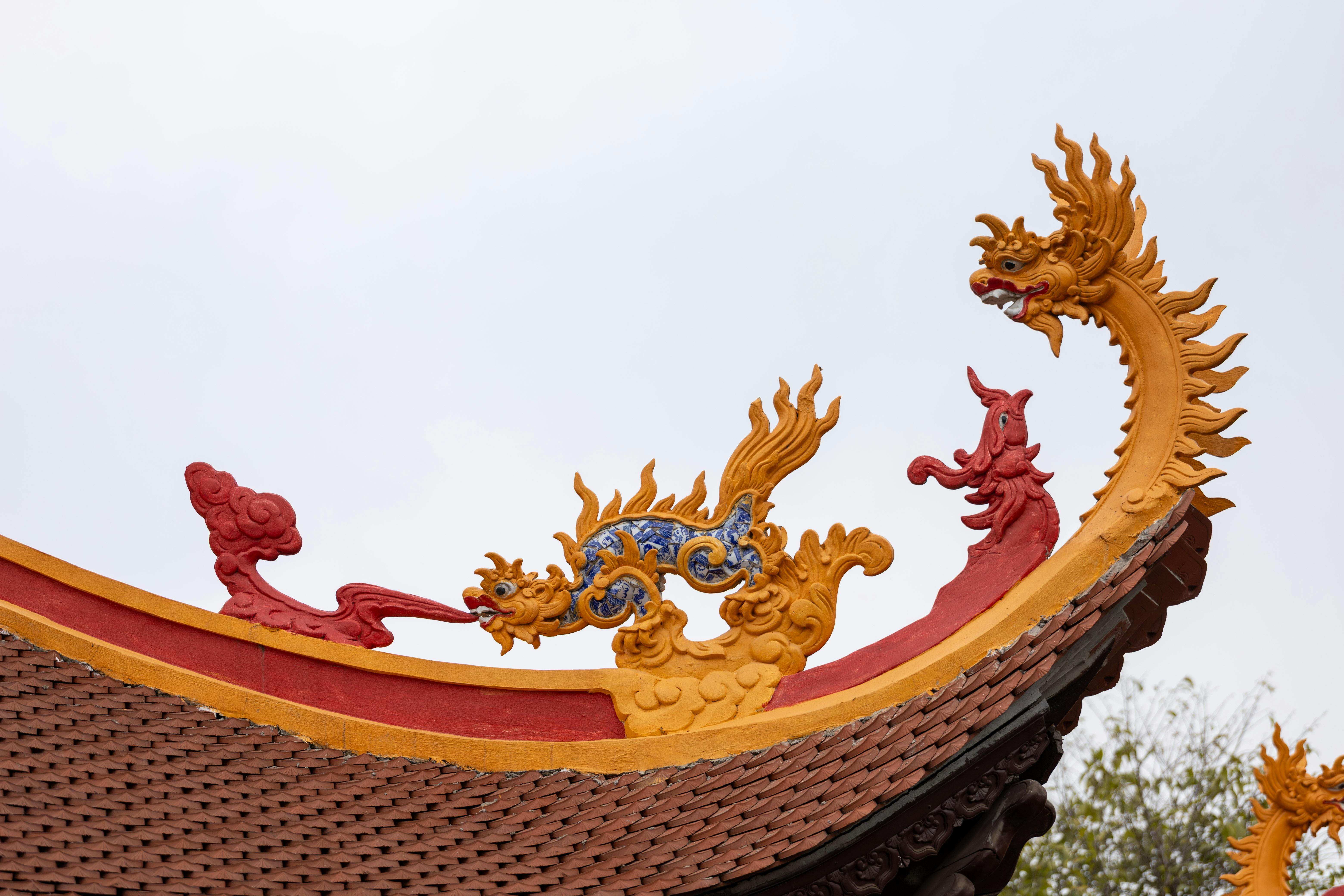Beautiful dragon ornament on a traditional Vietnamese temple roof in Hà Nội.