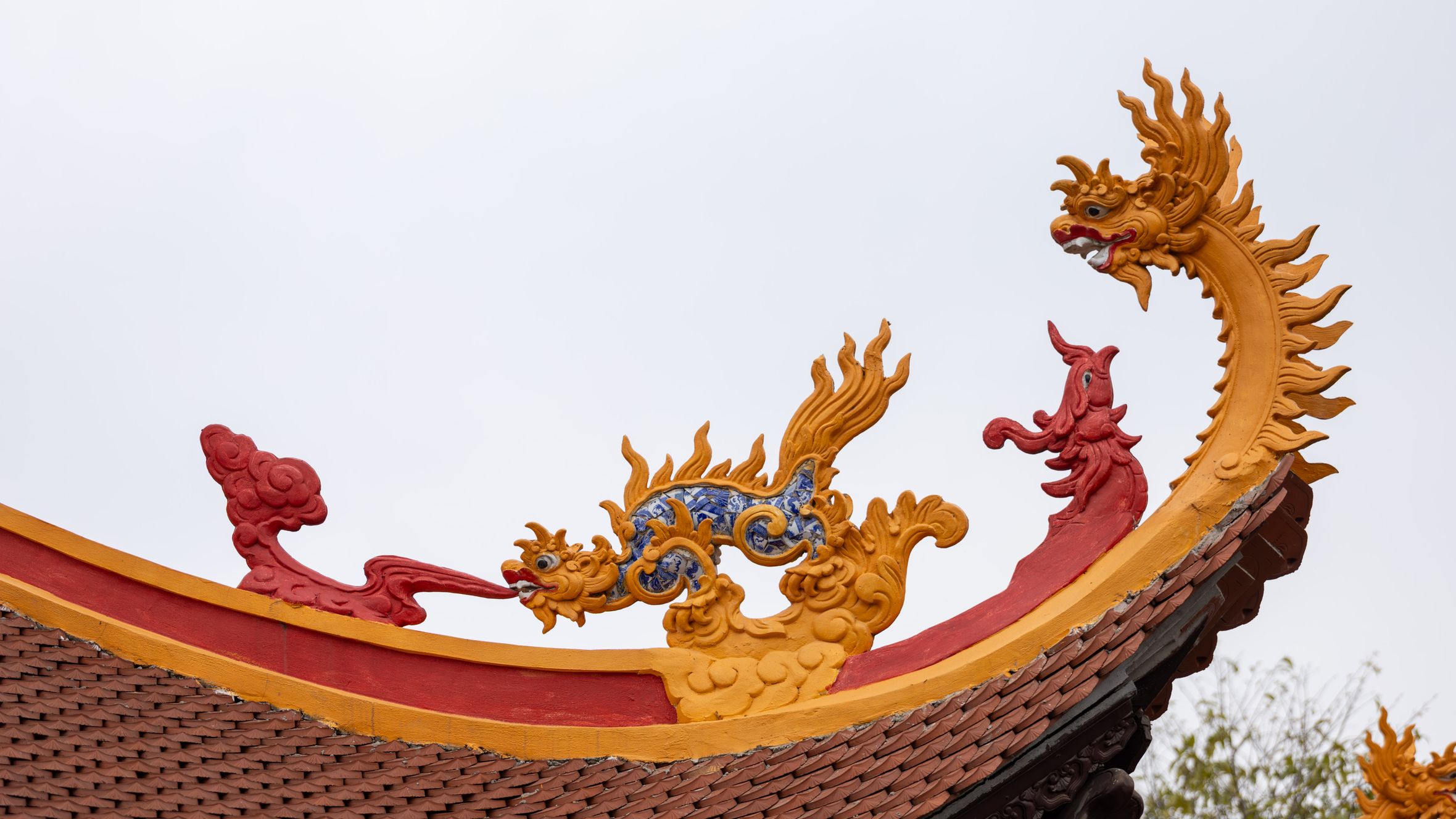 Beautiful dragon ornament on a traditional Vietnamese temple roof in Hà Nội.