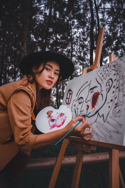Photo Of Woman Holding Paint Brush