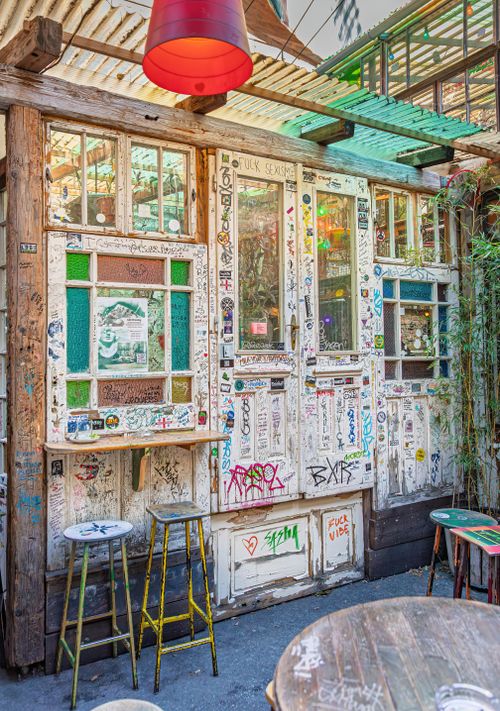 Free Explore a colorful and artistic ruin bar in Budapest with vibrant graffiti and rustic charm. Stock Photo