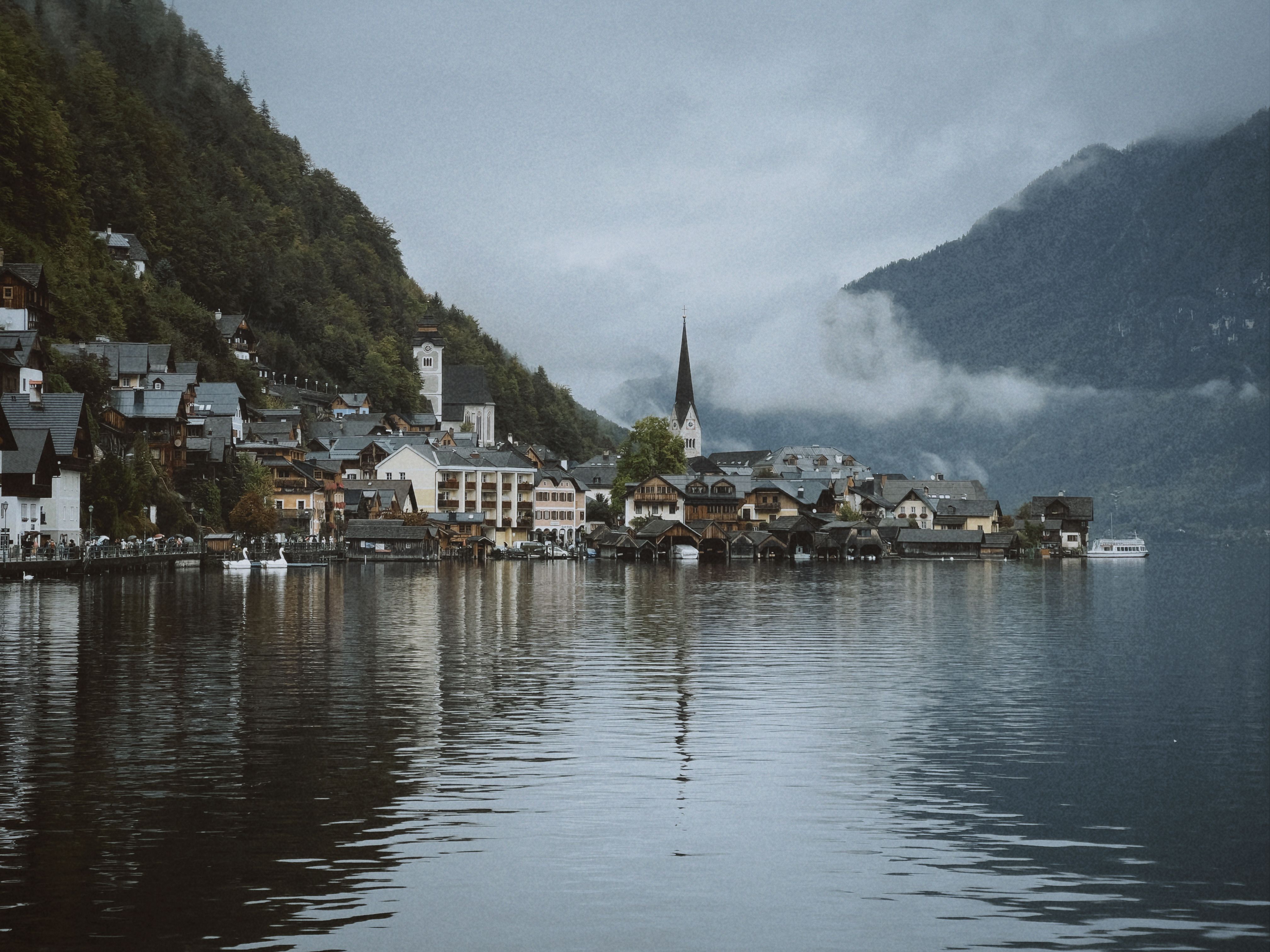 Scenic view of Hallstatt, Austria with mountains and tranquil lake reflection.
