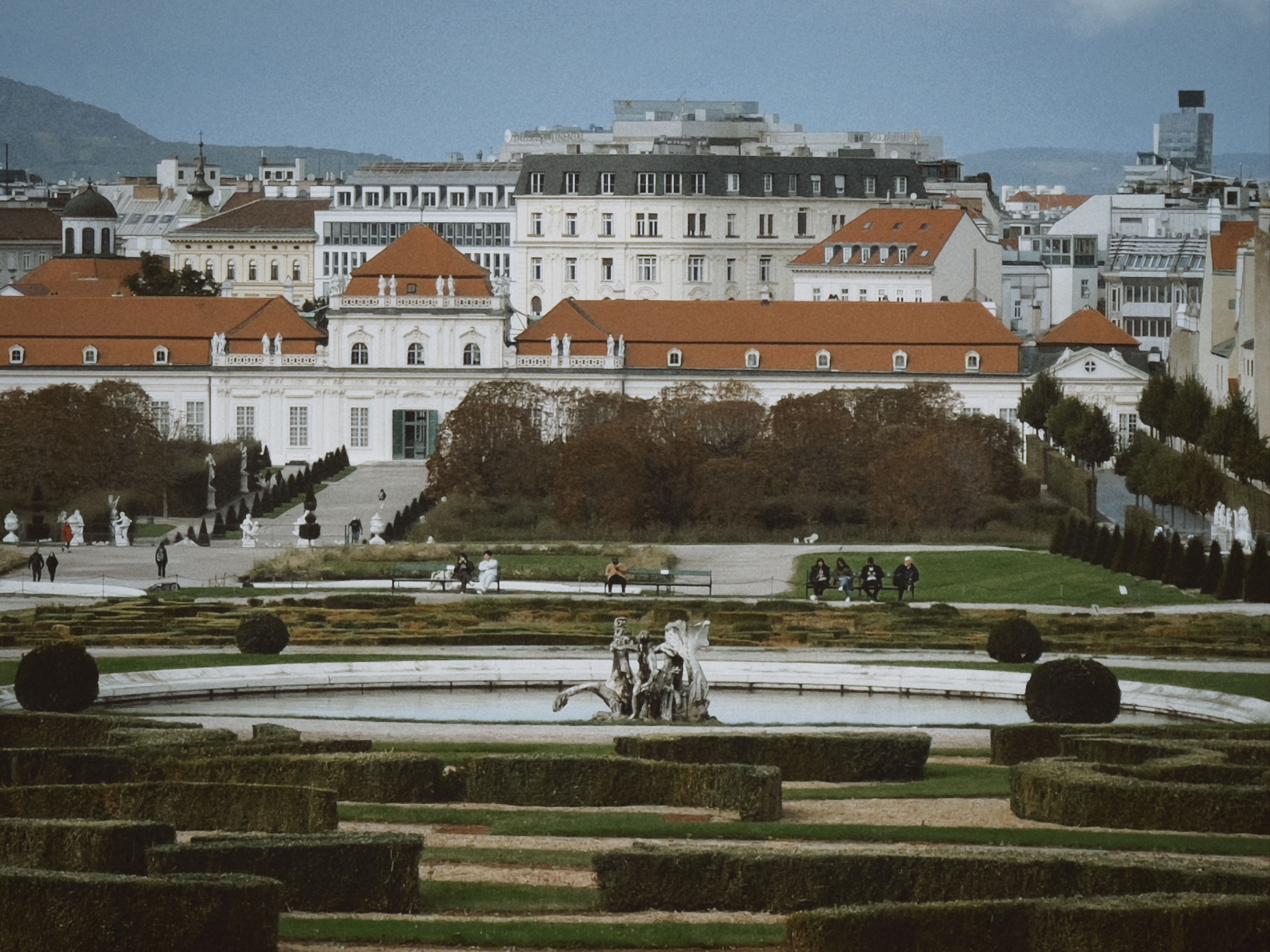 Free View of Belvedere Palace Gardens in Vienna with cityscape background, showcasing classic architecture. Stock Photo