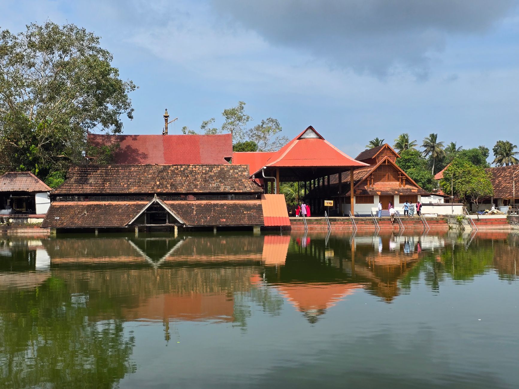 Padmanabhaswamy Temple mirrored in its tank - the complex anchors every first day in Trivandrum