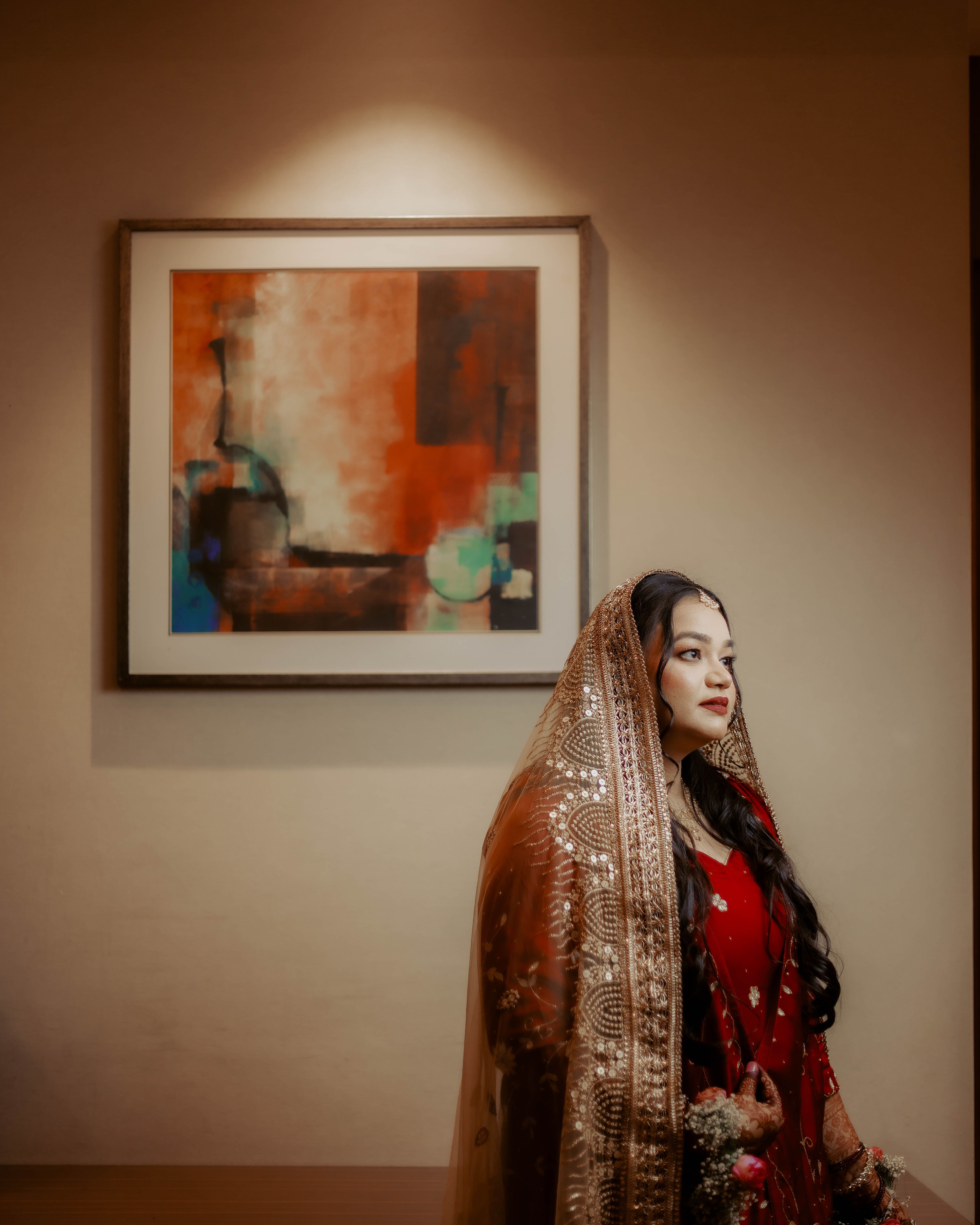Beautiful bride in traditional attire with artistic background. Ideal for cultural themes.