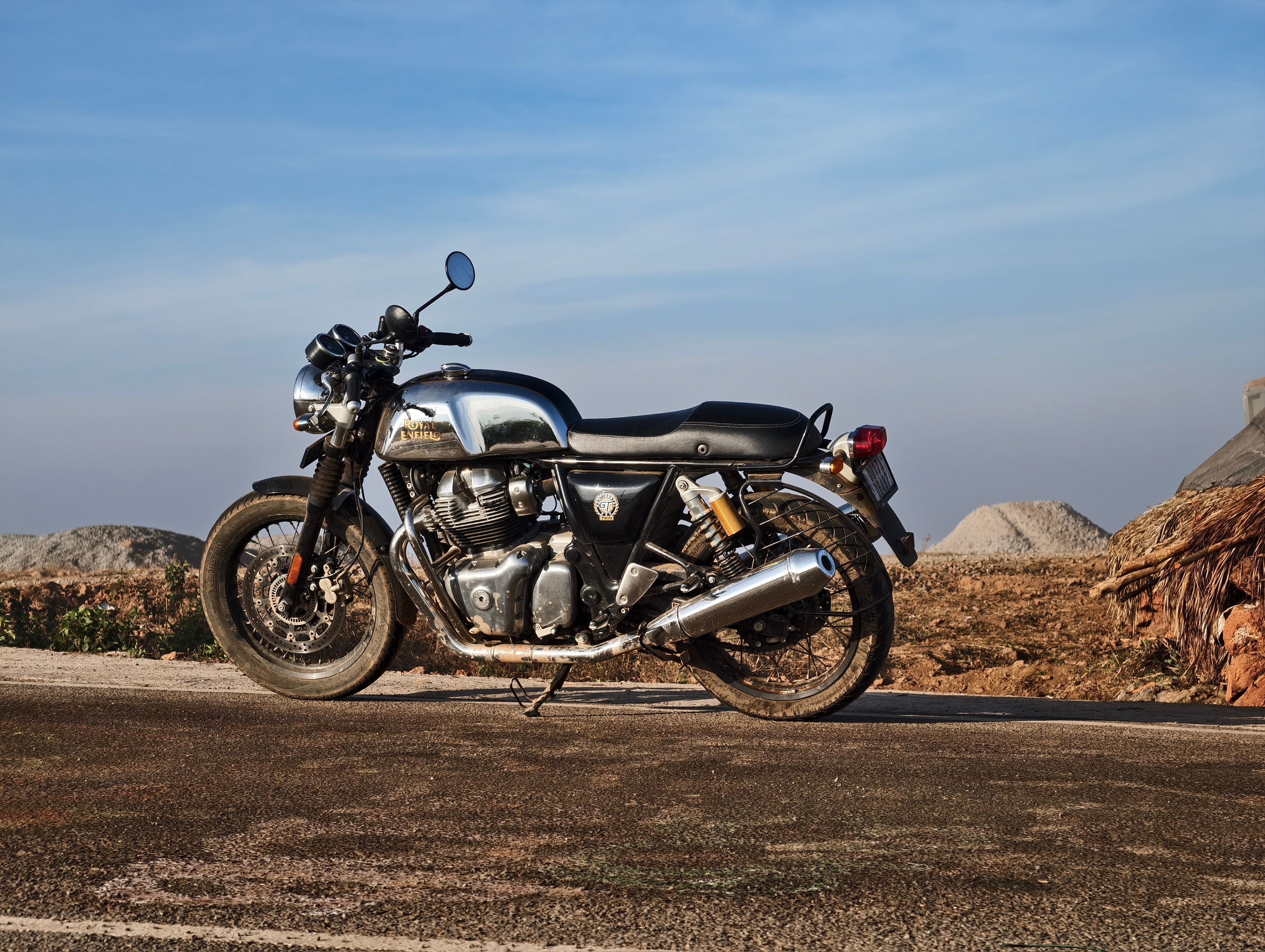 Classic Motorcycle on Open Road under Blue Sky · Free Stock Photo