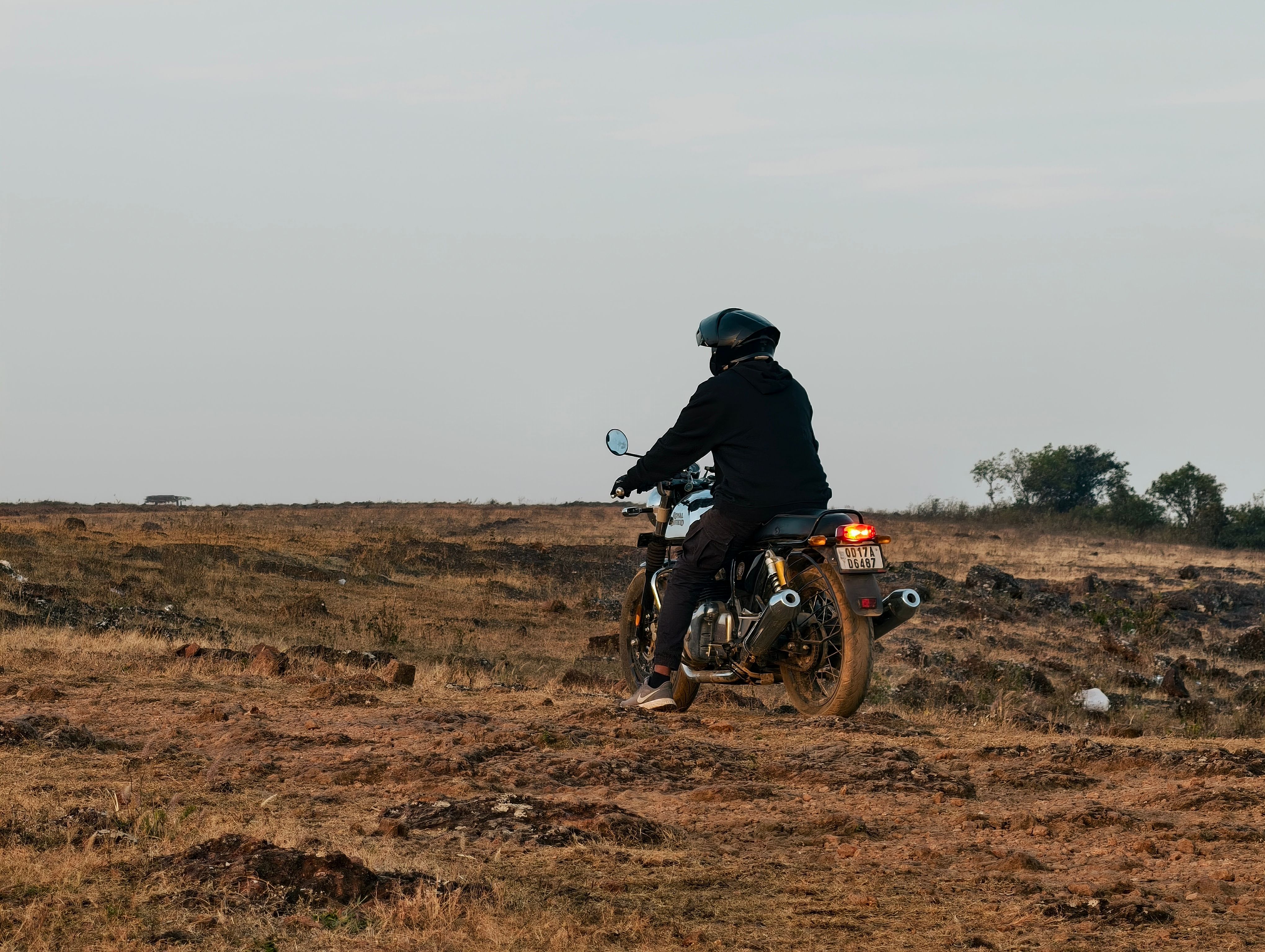 Motorcyclist Riding on a Remote Dirt Path · Free Stock Photo