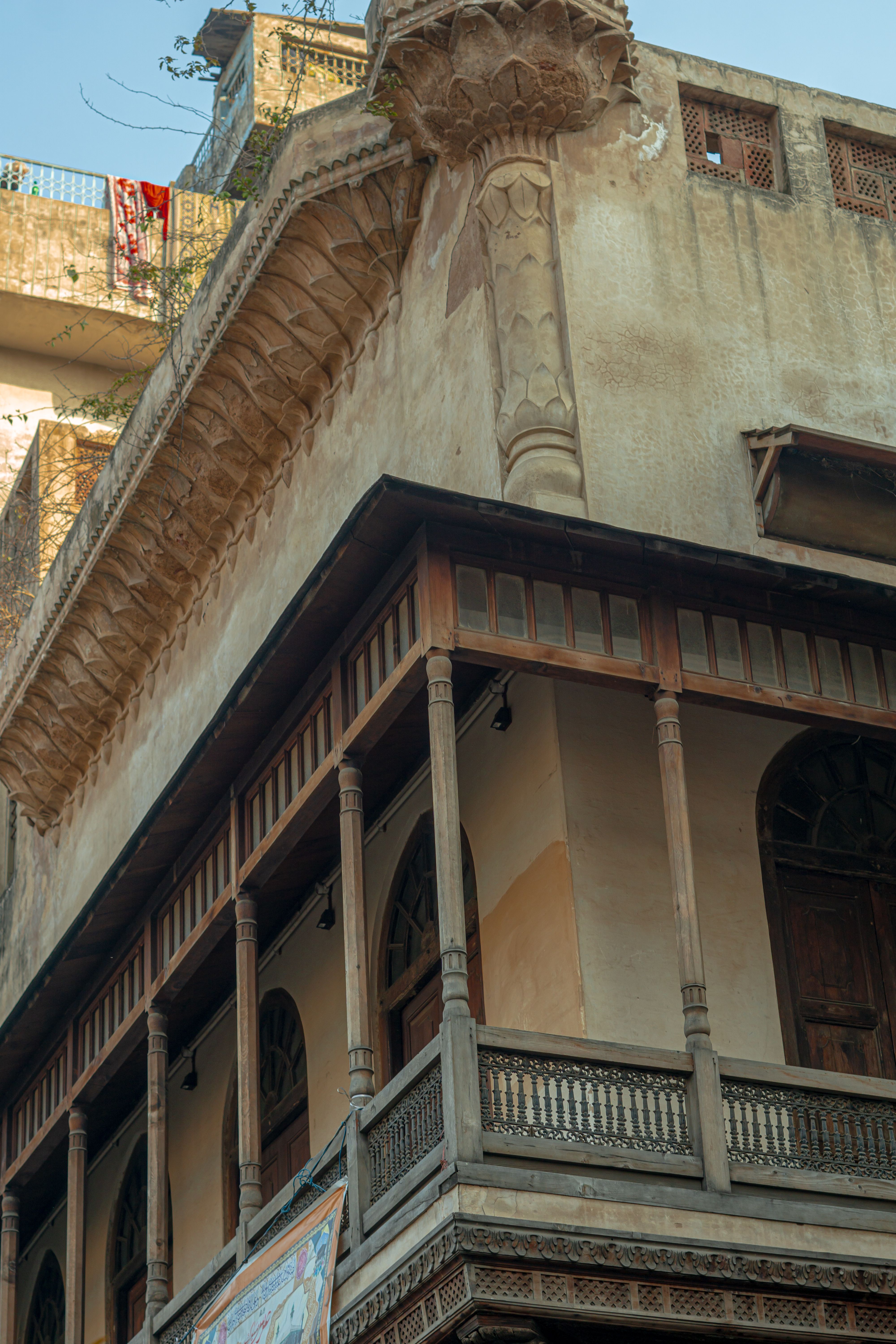 Close-up of a historic building facade showcasing intricate architectural details and rustic charm.