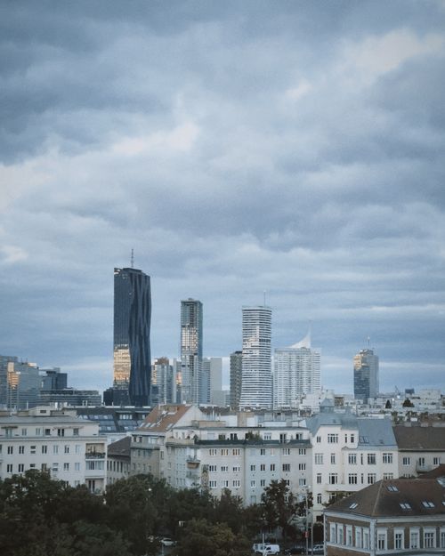 Free Skyline of Vienna showcasing modern skyscrapers under a cloudy sky. Stock Photo