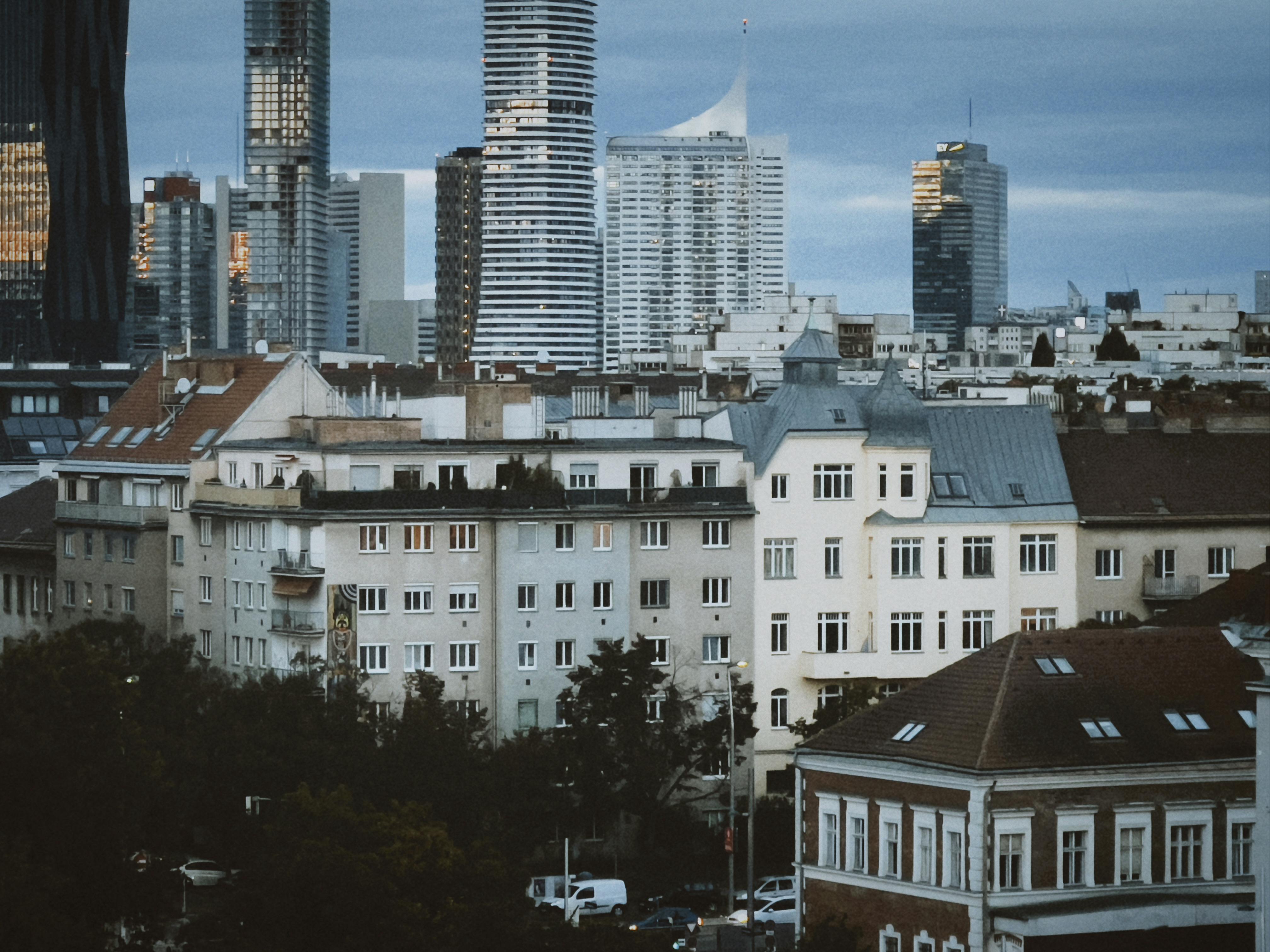 A stunning view of Vienna's skyline combining historic and modern architecture at dusk.
