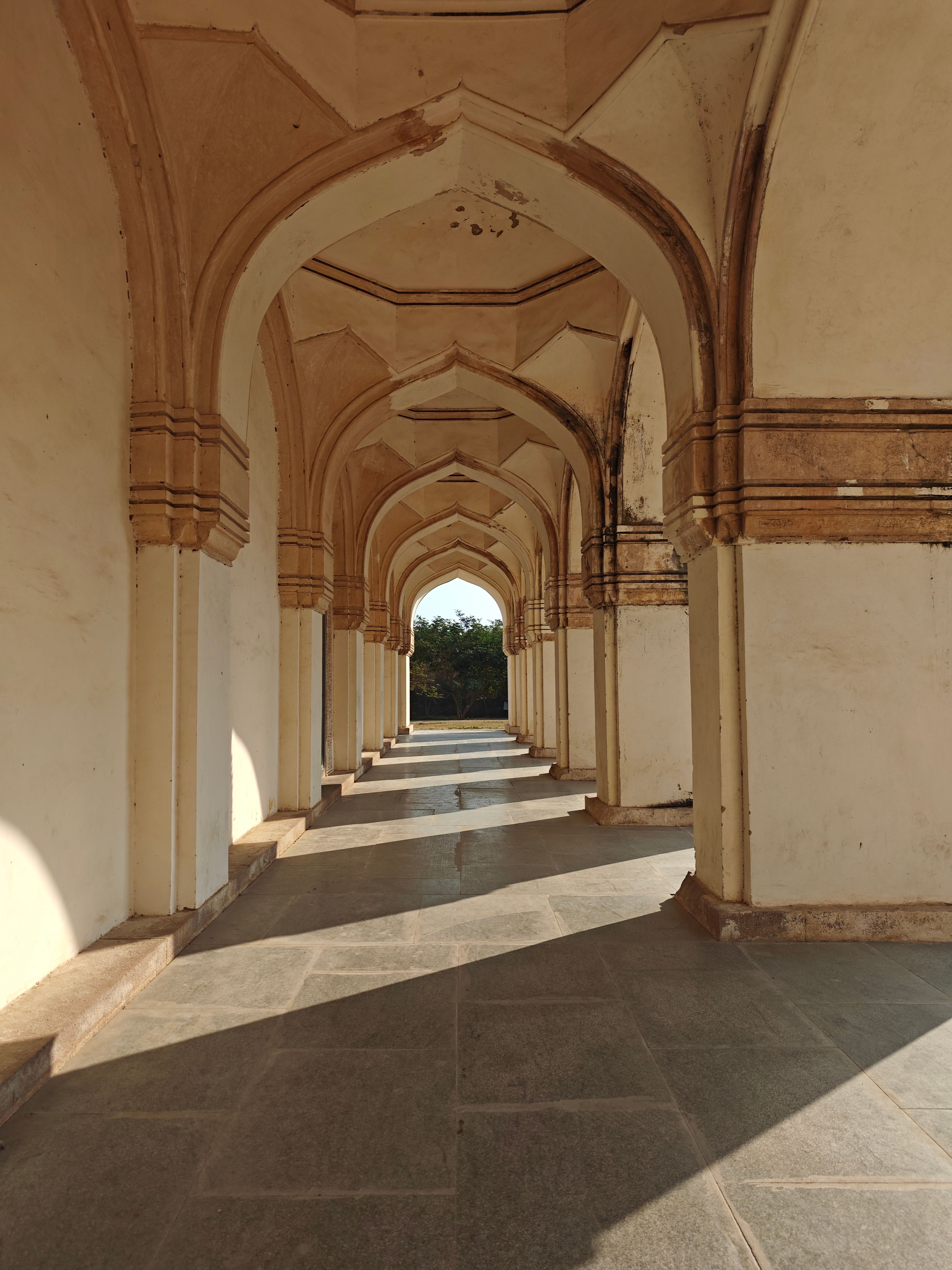 Sunlit Corridor of Historic Indian Architecture · Free Stock Photo